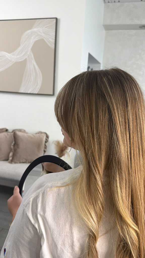 Golden blonde balayage with a soft blended transition
