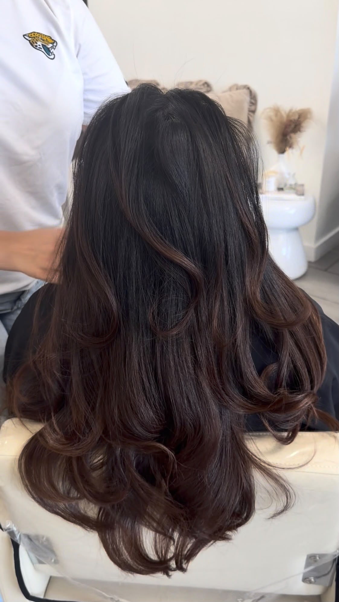 Smooth-looking glossy hair with a styled finish