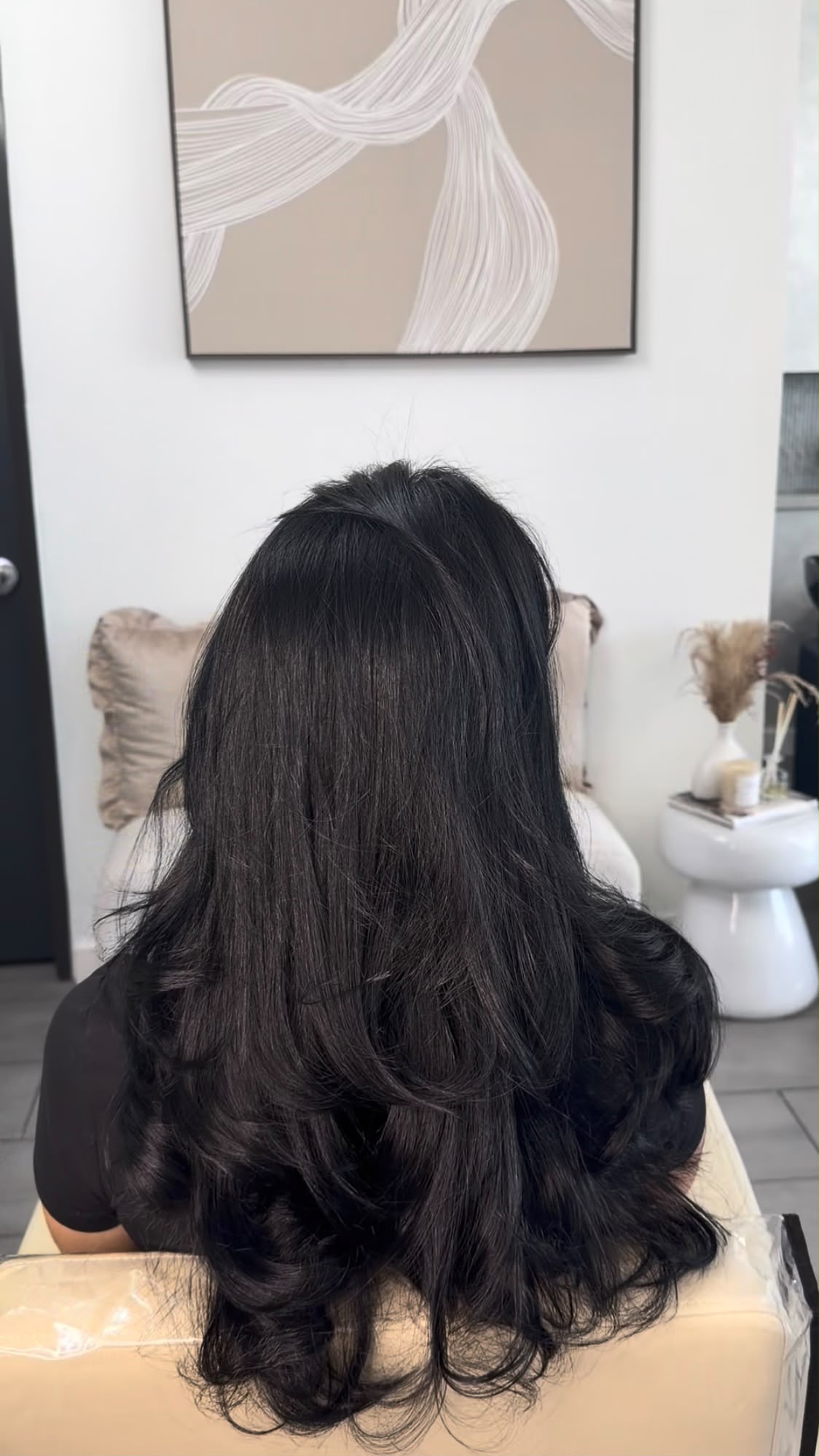 Women’s haircut with a smooth blowout finish